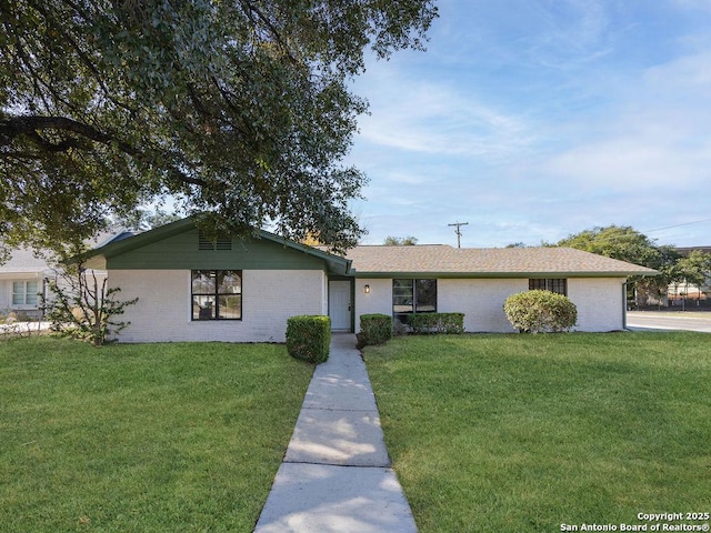 single story home with a front yard