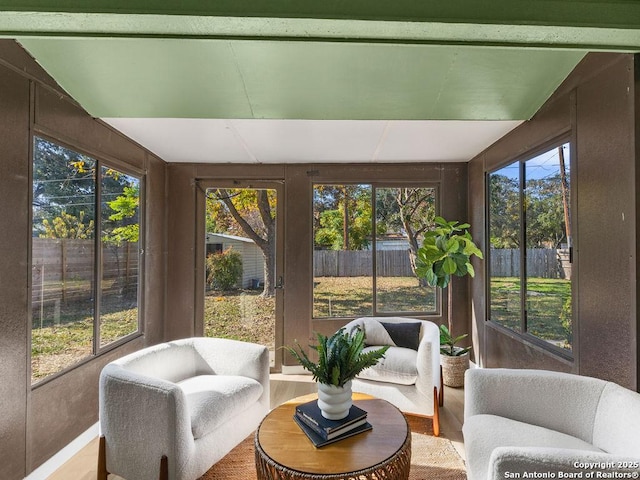 sunroom / solarium with vaulted ceiling