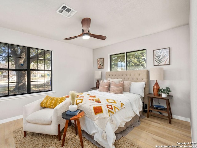 bedroom featuring ceiling fan and light hardwood / wood-style flooring