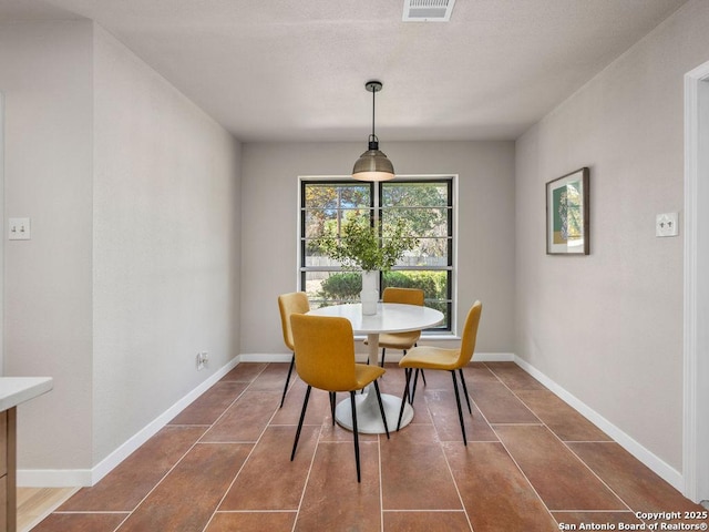 view of tiled dining space