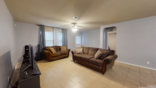 living room with ceiling fan and light tile patterned floors