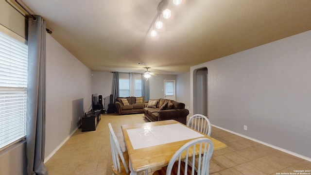 dining room featuring light tile patterned floors and ceiling fan