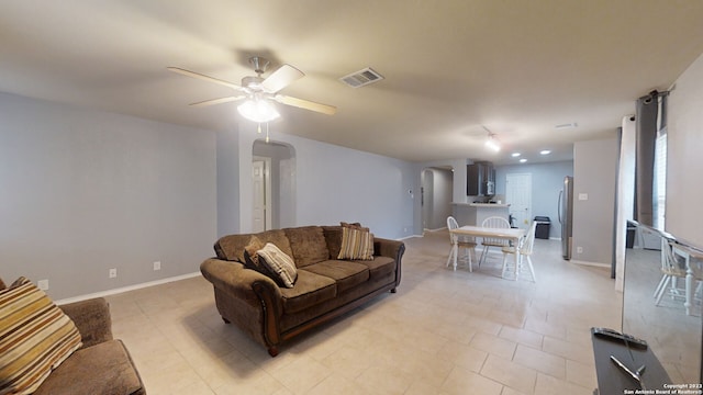 living room featuring ceiling fan