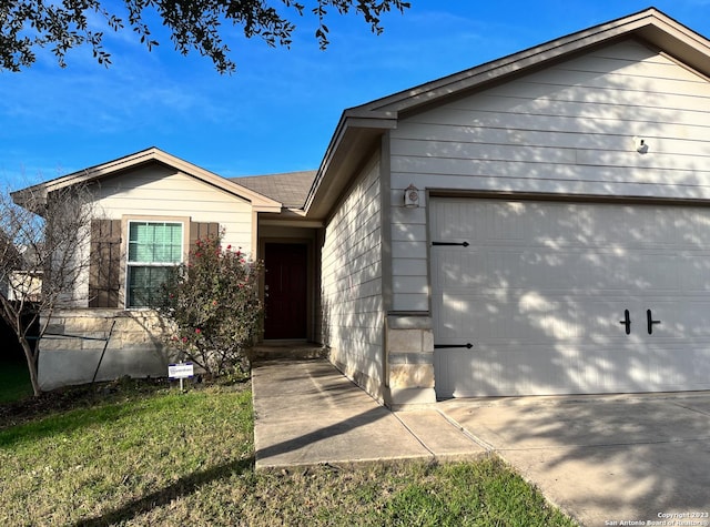 ranch-style home featuring a garage