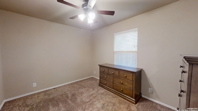 unfurnished bedroom featuring ceiling fan and light carpet