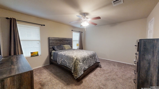 bedroom with ceiling fan and carpet