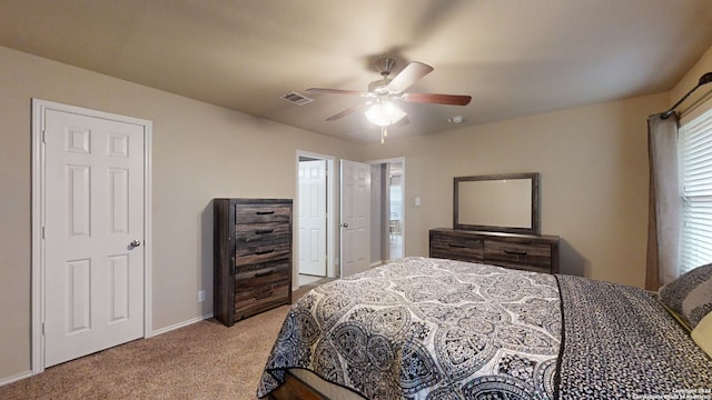 bedroom featuring ceiling fan and light carpet