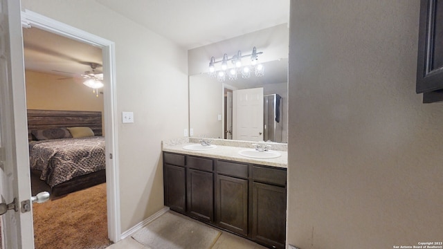 bathroom with ceiling fan, tile patterned flooring, and vanity