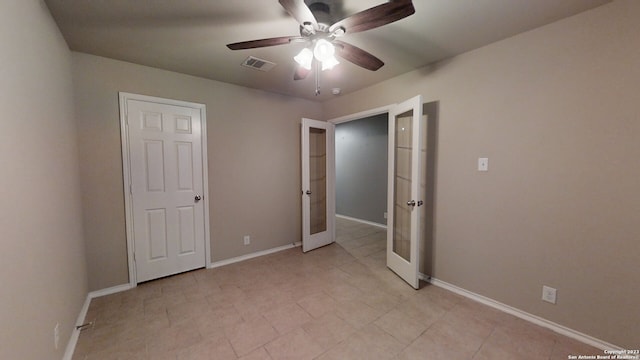 unfurnished bedroom with french doors and ceiling fan