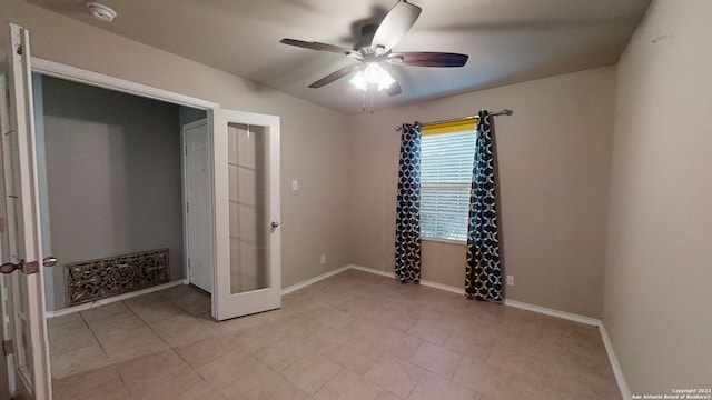 unfurnished bedroom featuring french doors and ceiling fan