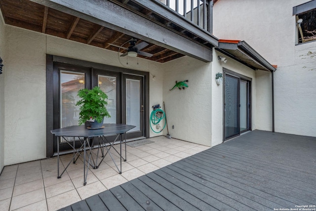 wooden deck featuring ceiling fan