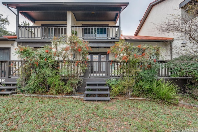 back of house with a balcony