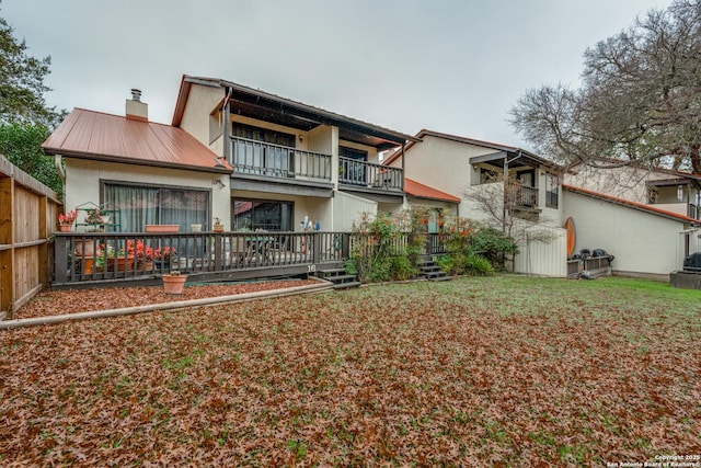 rear view of house with a balcony