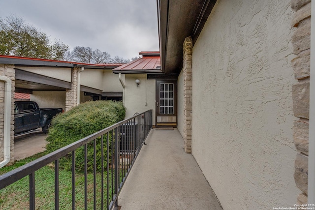 view of side of home with a balcony