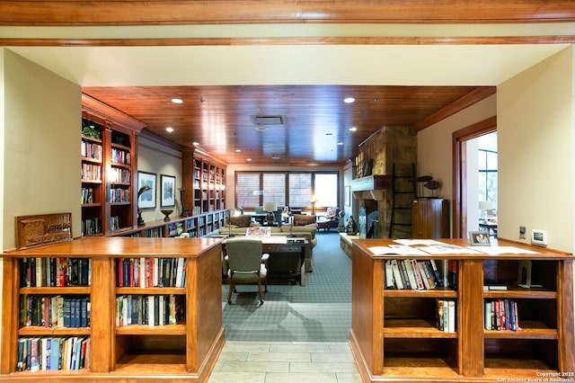 living room with a fireplace, ornamental molding, and wooden ceiling