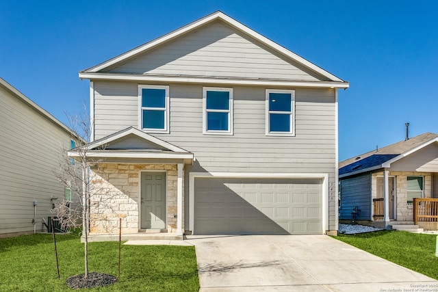 front of property with a garage and a front lawn