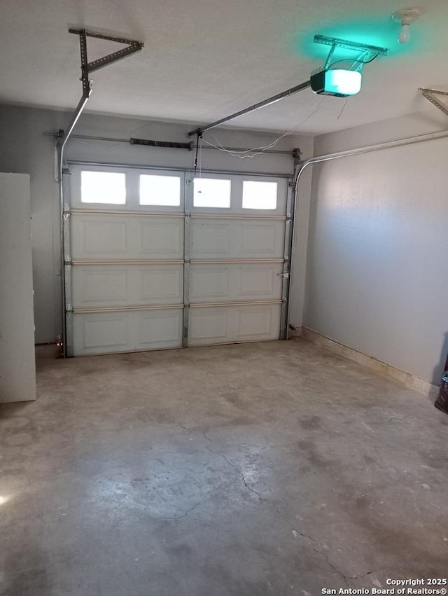 garage featuring a garage door opener