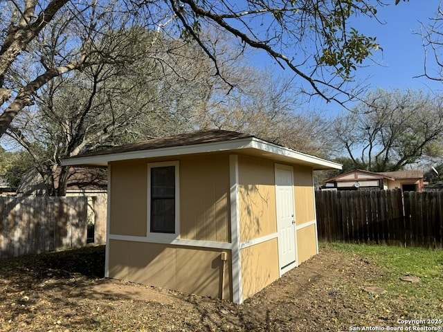 view of property exterior featuring a shed