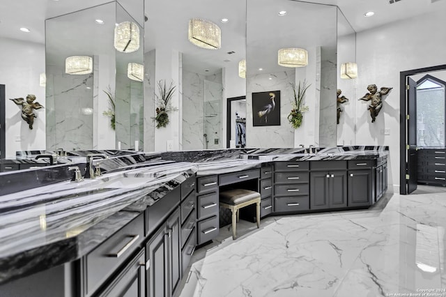 bathroom with vanity and a shower with door