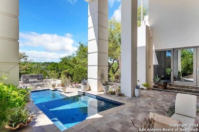 view of swimming pool featuring a patio