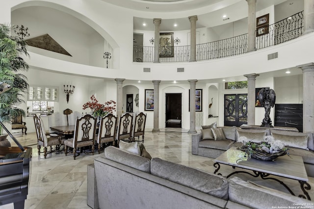 living room featuring french doors and a high ceiling