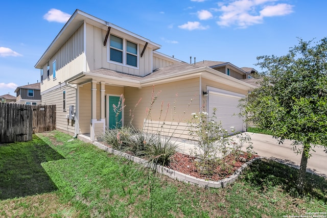 view of front facade with a garage and a front lawn