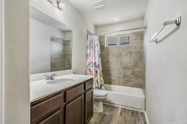 full bathroom featuring toilet, vanity, shower / bath combo, and hardwood / wood-style flooring