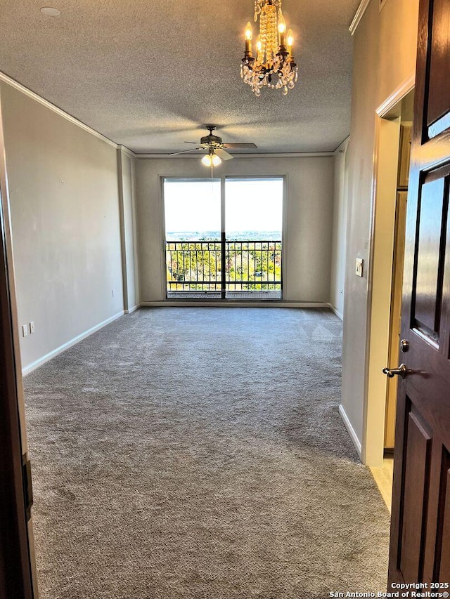 carpeted empty room with a textured ceiling, ceiling fan with notable chandelier, and crown molding