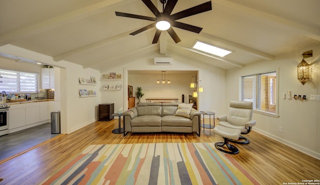 living room featuring ceiling fan, a wall unit AC, light hardwood / wood-style floors, and lofted ceiling with beams