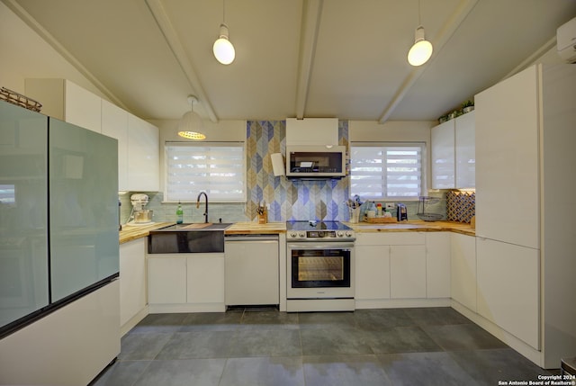 kitchen with dishwasher, white cabinets, range with electric stovetop, fridge, and decorative light fixtures