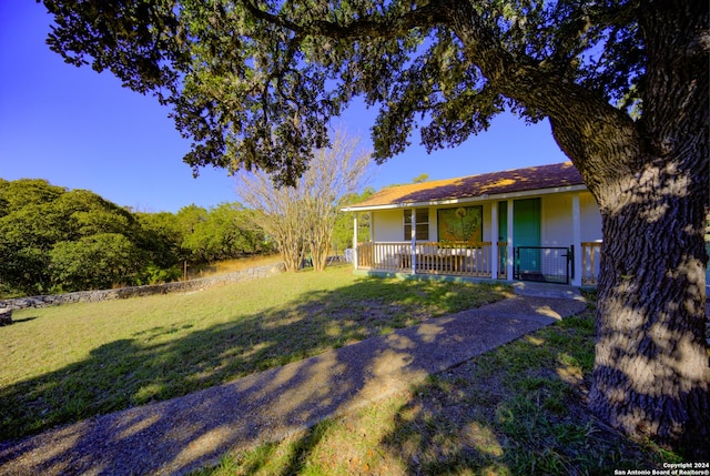 view of yard with covered porch