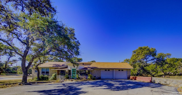 single story home with a garage