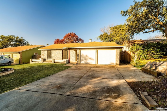 ranch-style house with a front lawn and a garage