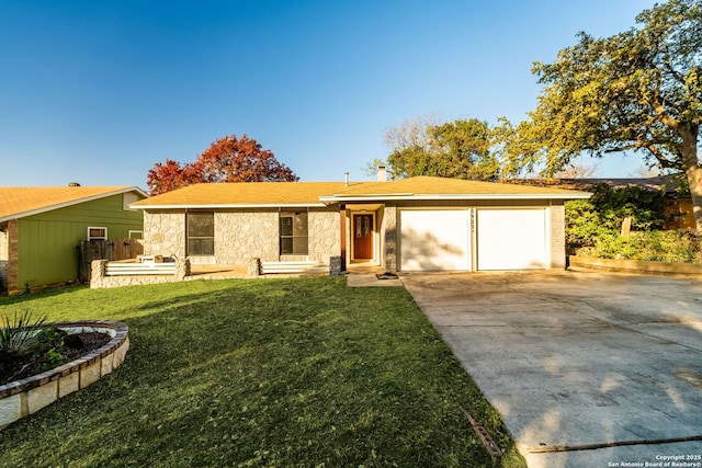 ranch-style house with a front yard and a garage