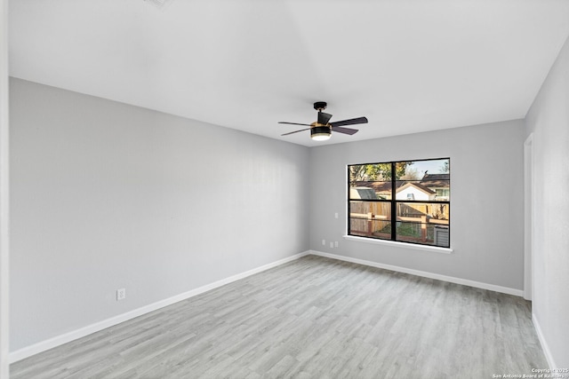 unfurnished room with light hardwood / wood-style flooring and ceiling fan