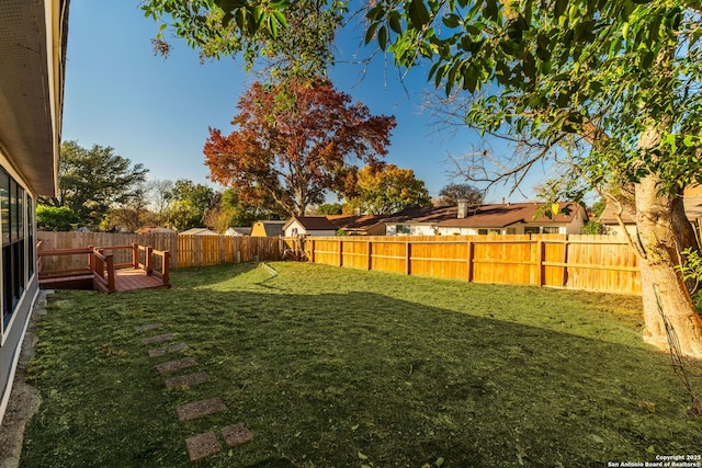 view of yard with a wooden deck