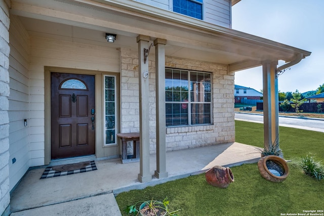 property entrance featuring covered porch