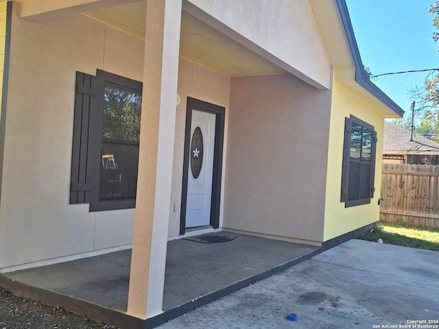 entrance to property featuring a patio area