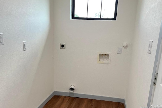 laundry room featuring hardwood / wood-style flooring, electric dryer hookup, hookup for a gas dryer, and hookup for a washing machine