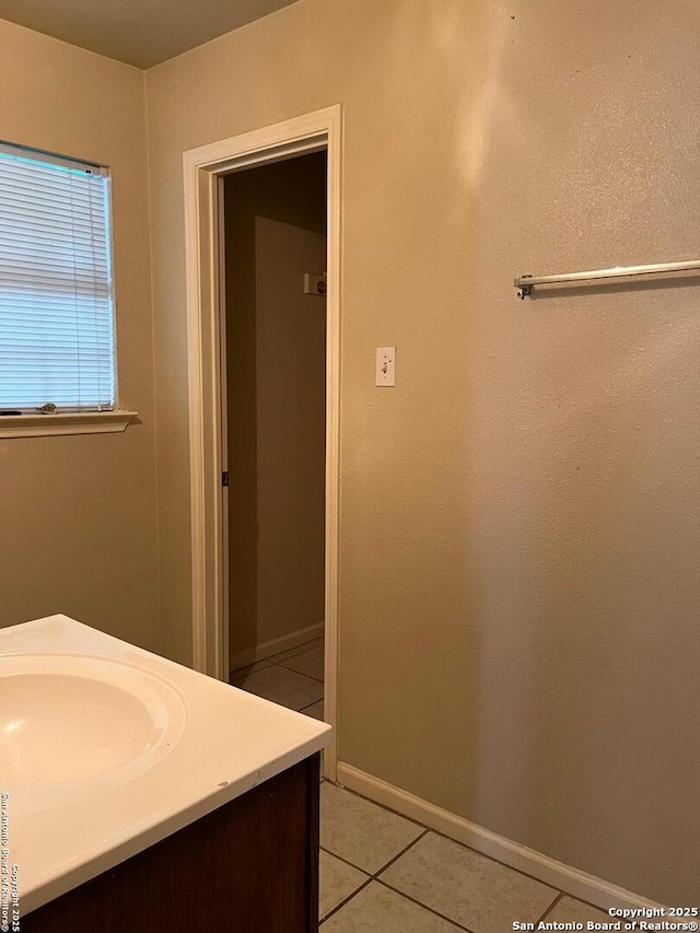 bathroom featuring tile patterned floors and vanity