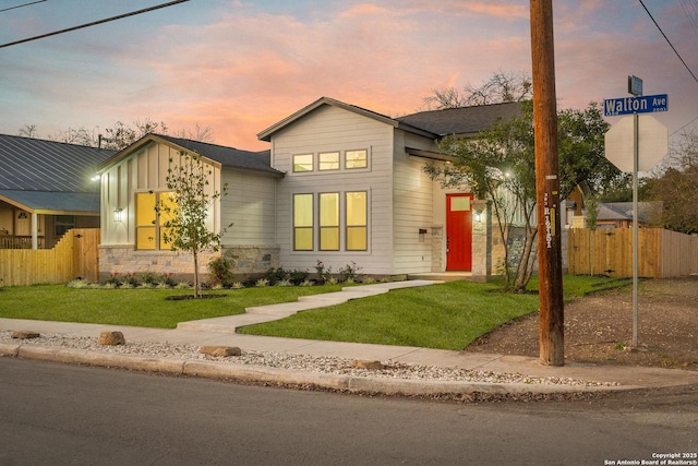 view of front of home with a yard