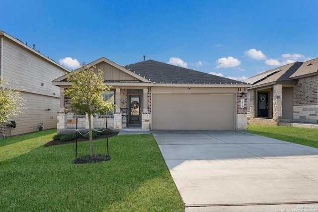 view of front facade with a garage and a front yard