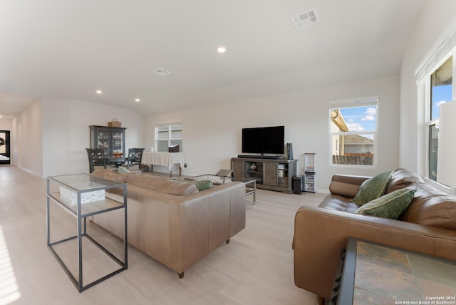 living room with lofted ceiling