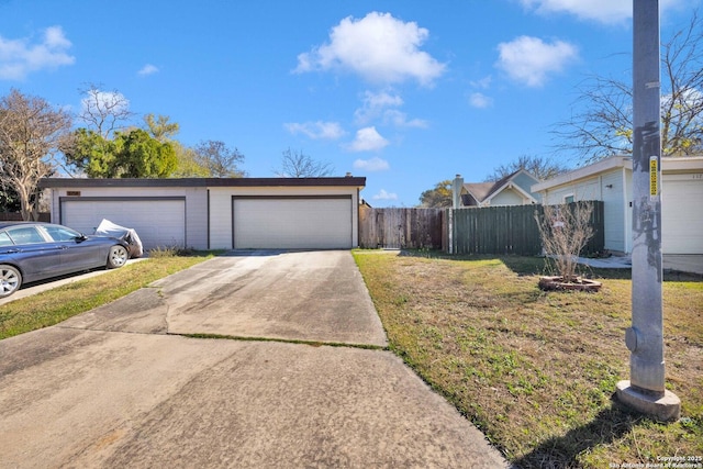 garage featuring a lawn