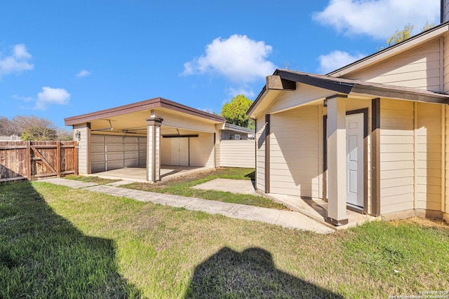 exterior space featuring a lawn and an outbuilding