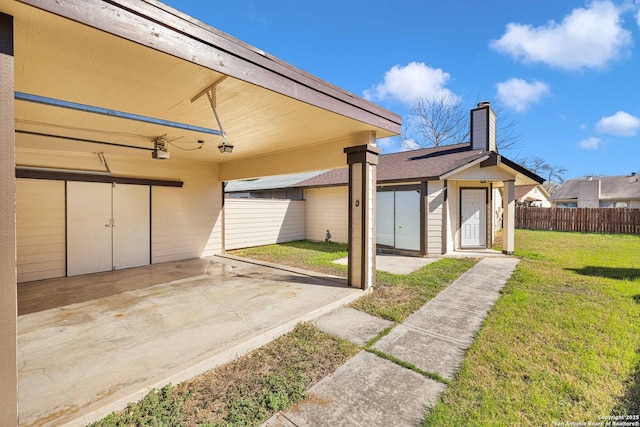 exterior space with a yard and a garage door opener