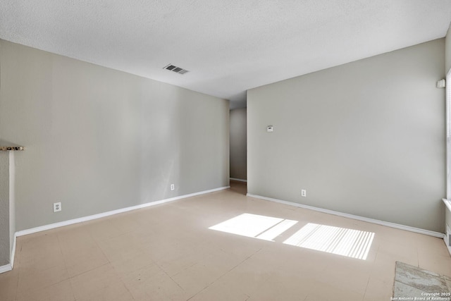 empty room with a textured ceiling