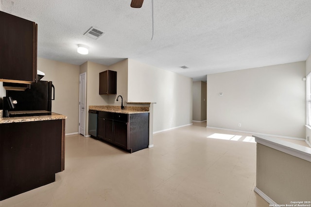 kitchen featuring black refrigerator, dark brown cabinetry, ceiling fan, sink, and dishwasher