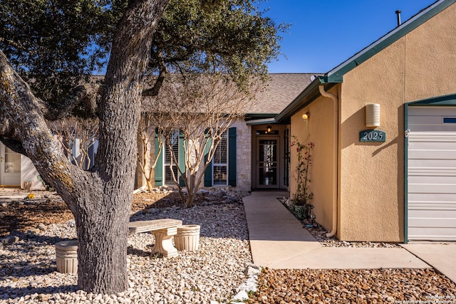 doorway to property featuring a garage