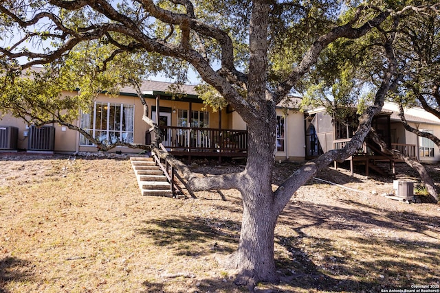 back of house featuring central AC